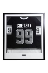 Custom framed hockey jersey on display in Richmond, BC – framing a jersey near me. Jersey framing